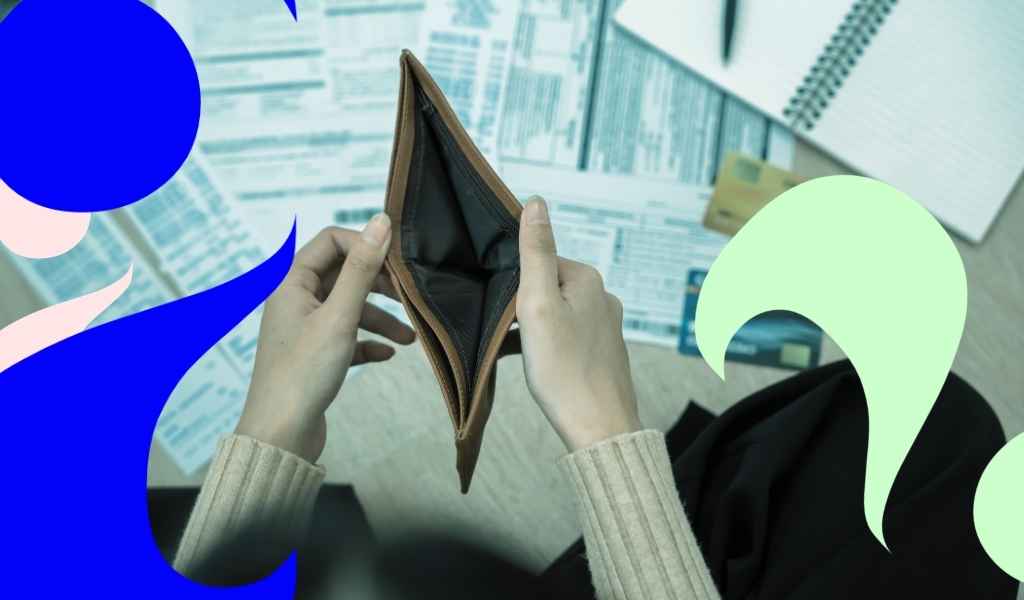 Woman holding empty purse with medical bills scattered